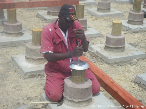 Then a bit of metal strapping, like the  mukua we used between courses of stone in the kitchen building gets screwed on top and eventually screwed on to the floor beam.