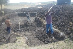 excavating the area for the water tanks. We're getting rid of the black cotton soil, and then we will make four inch concrete pads for each of the six 24,000 liter tanks that will go here.