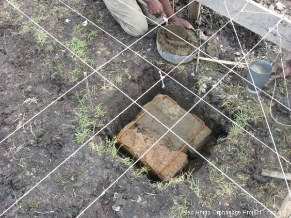 Two of the bent pieces of Y8 rebar are put between each course for torsion stability.