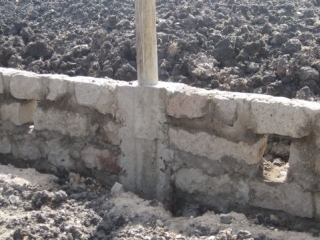 These little holes, which will be below the level of the slab, are to let air expel in case of an earthquake or the like, so the foundation walls don\'t blow out. 