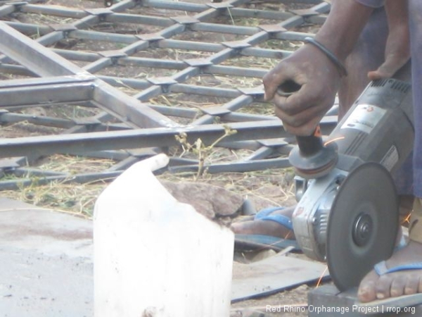 A young man who looks like he is in the process of grinding off his own foot.