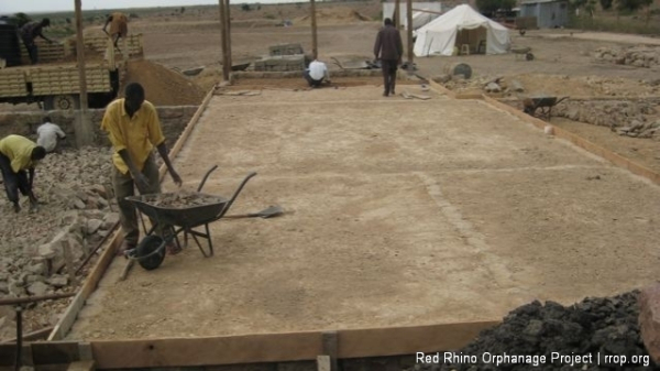 Opyo, the carpenter, finished putting up the shuttering for the slab,