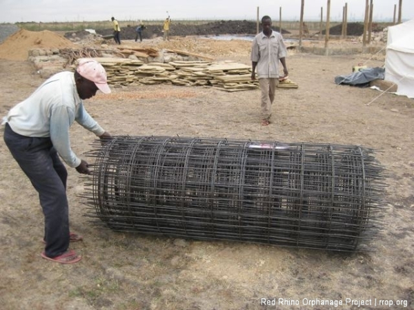 Here\'s the roll of BRC, about 100 square meters. It\'s very thick, A142, and very heavy. They loaded it into the back of the pick up with a fork lift at Doshi\'s, the hardware place. We muscled it off with a bunch of guys.