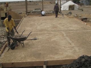Opyo, the carpenter, finished putting up the shuttering for the slab,