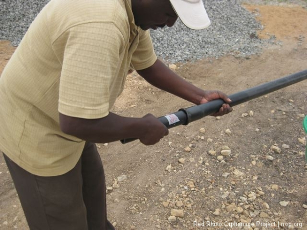 He heated the end of the long pipe, took a a short piece of the same pipe and stretched the end accept the other long pipe just like the adapter would have.