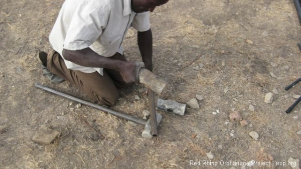 We use 12 pound sledge hammers and we have been breaking the handles off like twigs. So I got a 20\' length of 1\" pipe called black pipe. Very strong stuff. And Gilbert and I cut some handle lengths which Gilbert  then cut eight half inch grooves in the top with a hack saw,