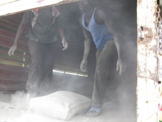 The view inside the lorry that delivered the dusty stuff. That\'s our guy, Obam, on the right.