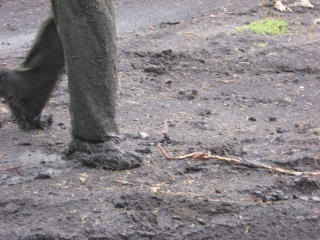 This one of the guy\'s feet who was pushing the truck. He\'s not wearing shoes.