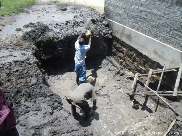 In any case we couldn't back fill this site in the normal crushed hardcore and murram fashion, since the water would too easily find its way through. So we needed to fill it entirely with very compacted murram and persuade it to an easier path. But because of the heavy rains and in spite of repeated pumping efforts, we couldn't get it dry enough.