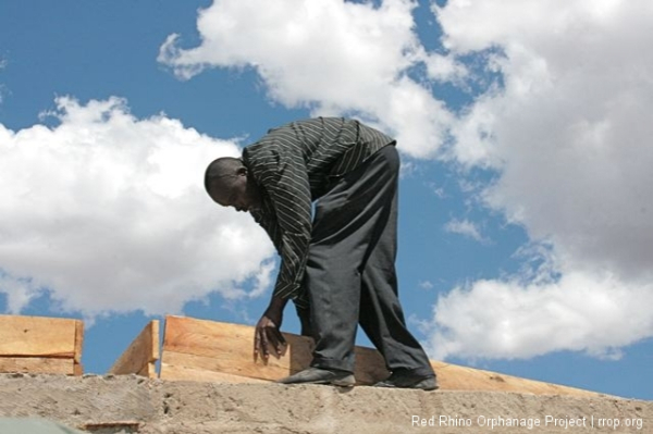 On the lower forty, Isaiah and the building boys were at work on the ring beam form.