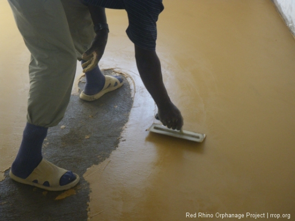 without ever leaving a seam, the yellow mixture is spread in a very thin,