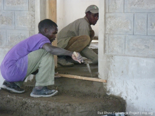 Finishing the concrete on the steps into the main patio.