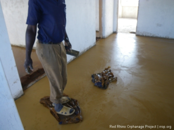 Japolo wasn't satisfied with a few spots in the middle section of the room, so he got wet cement bags