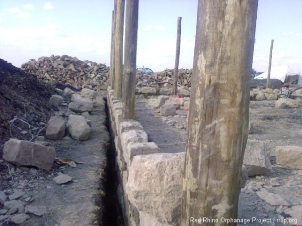 Then we made flat wooden forms around each pole and cemented their futures for good.