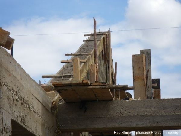 The gable form, and the completed gable, after concrete had been added and turned it from stairs to a slide.