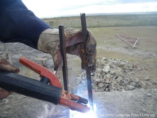 Peter attaching a U bolt in the ring beam that the trusses will be welded to.