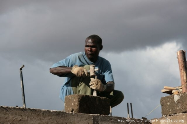 David chiseling what will become one of the triangular gable stones.