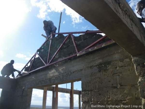 We hoisted up one of the trusses to prescribe the exact height and angle of the gable.