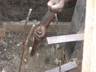 We used the two pipe bending method. The shorter bottom pipe holds the rebar steady and provides the point at which the top pipe\'s force can make the bend.