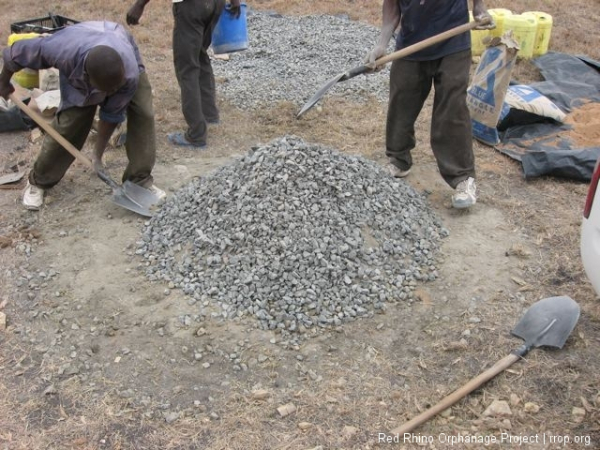 In this case, one part cement, three parts sand, and 4 parts ballast (the small rocks).