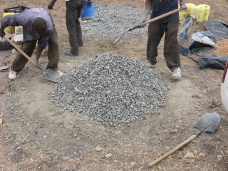 In this case, one part cement, three parts sand, and 4 parts ballast (the small rocks). 