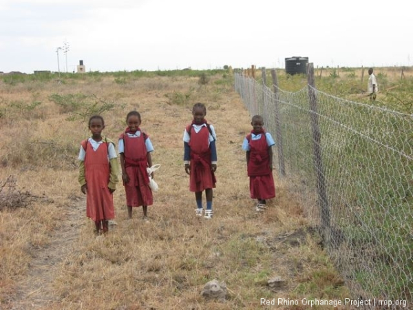 Our work sometimes brings visitors. This is from left to right: Rosie, Esther, Sylvia and Agnes. On their way home from school, having walked the five kilometers from Kinani.