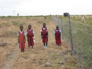Our work sometimes brings visitors. This is from left to right: Rosie, Esther, Sylvia and Agnes. On their way home from school, having walked the five kilometers from Kinani.
