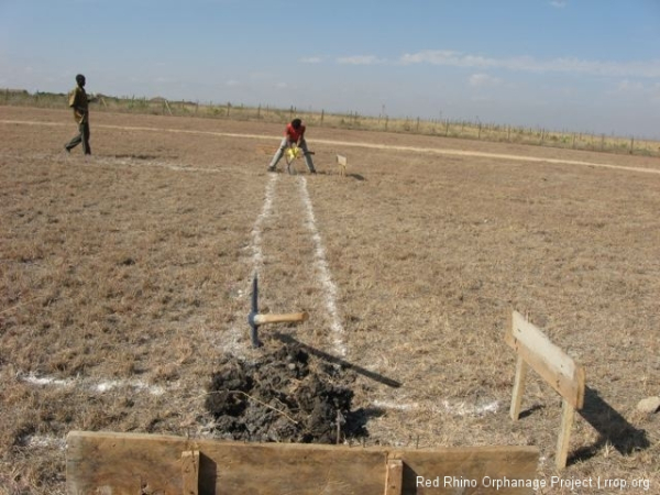 This photo must stand for the record as a ground breaking ceremony. These are the first whacks at the adamantine black cotton soil that all must go so we can build, as they say, on a firm foundation.