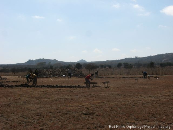 As the guys were whaling away at the rock hard dirt with pickaxes and mattocks