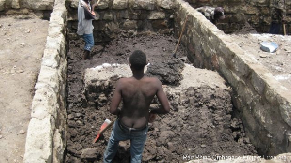 One of the only times I\'ve ever seen a Kenyan work with his shirt off. This picture may go some way to explaining why.