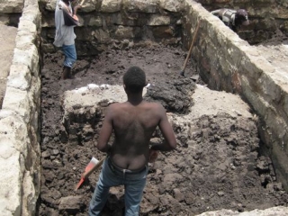 One of the only times I\'ve ever seen a Kenyan work with his shirt off. This picture may go some way to explaining why.