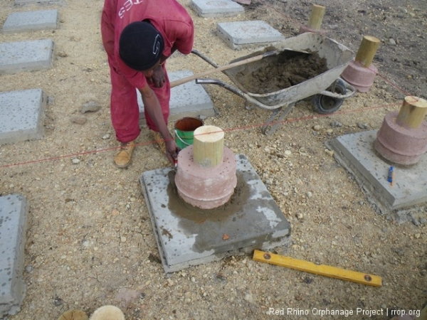 Each of our 180 paving slabs gets one of the pilings.