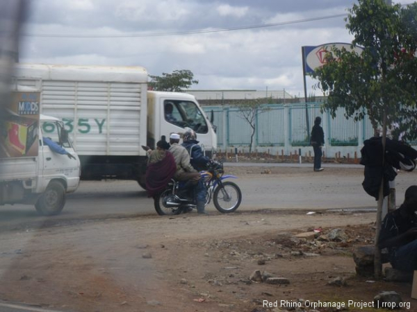 Motor bike taxi, the three person model, which occasionally doubles as the four person model.