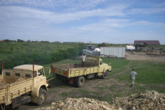 That's Erastus' truck doing the towing. He just brought a load of hardcore and is on his way back to the quarry for another.