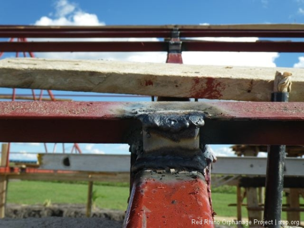 Peter cut from 38mm square bar, about a million of these little hollow steel squares to weld to the purins when they were welded to the trusses. You can see here that these little guys are what keep the purlins supported firmly on the right angle that they need to form a flush surface to screw the mabti roof to. Is that at all clear?