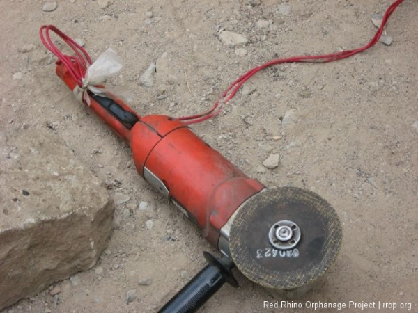 But he remembered his grinder, newly repaired with the wiring securely wrapped in a plastic bag.