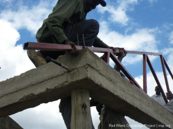 Opyio fitting the truss end into the U joint. The engineer who designed the trusses made a mathematical error and we had to modify the small trusses. It ultimately caused us a huge headache.