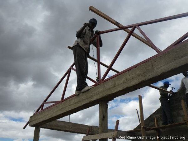 We held the trusses in place with timber braces until we had all the purlins welded on.