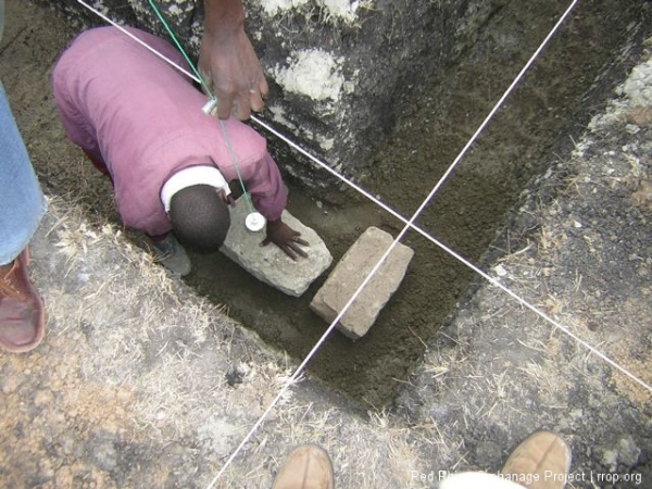 And with the next stone, the completed corner, our first right angle.