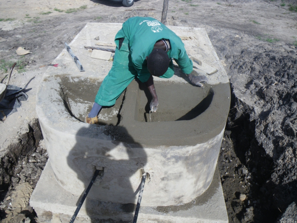 Rogers, the other mason was working on another stand for a water tank which includes two sinks of our own design for washing clothes.