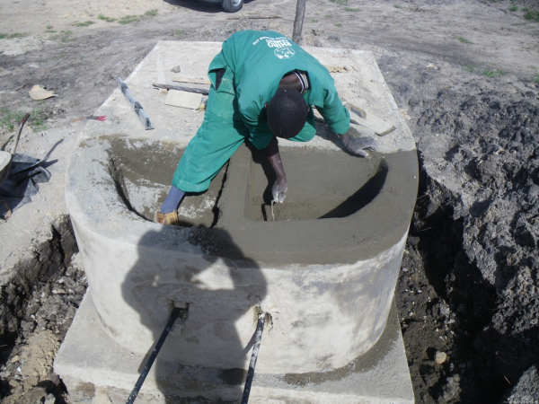 Rogers, the other mason was working on another stand for a water tank which includes two sinks of our own design for washing clothes.