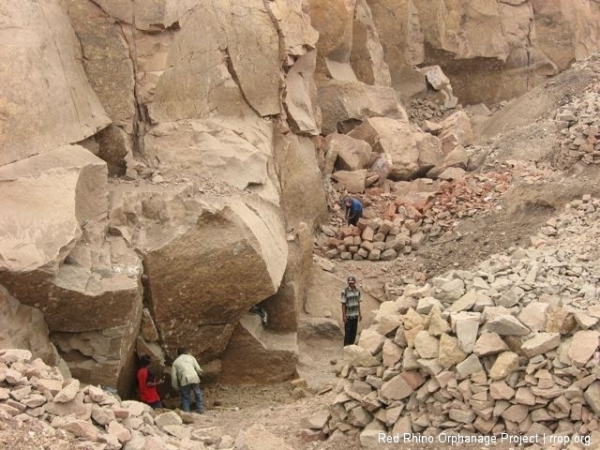 And very tough guys work them, hacking out big chunks of overhanging rock, which is then hand cut into 9\"x9\"x whatever blocks, which are then sold for 16 Kenya shillings a linear foot (about a quarter). It\'s going up to 20 ks per foot on Monday. It\'s dangerous work and a few guys get killed every year.