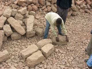 The quarry guys lay out the stones.