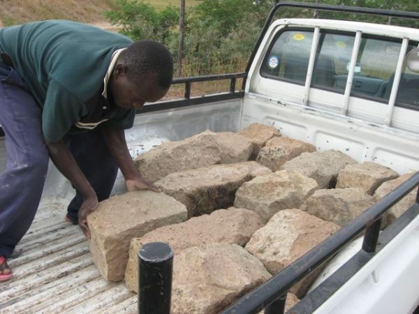 We moved the quarried stone up from the three acres to the highest spot on the five acres, where we had laid the foundation for the 3000 liter water tank stand.